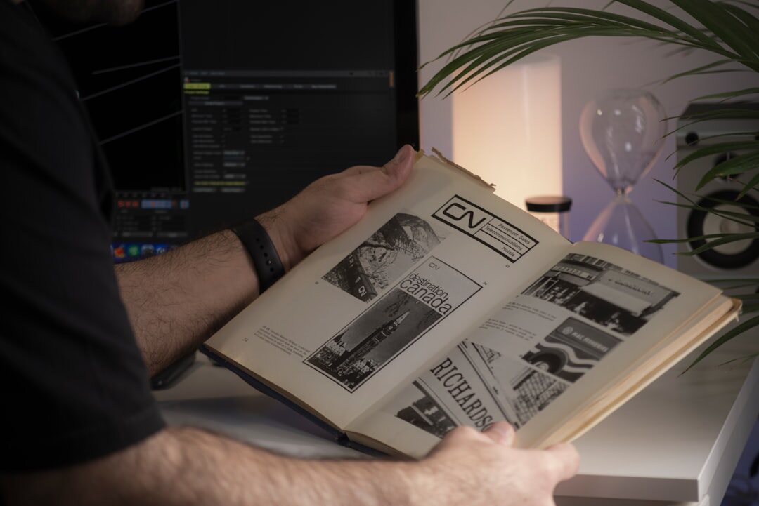 Editorial team working together at a desk with archive photos