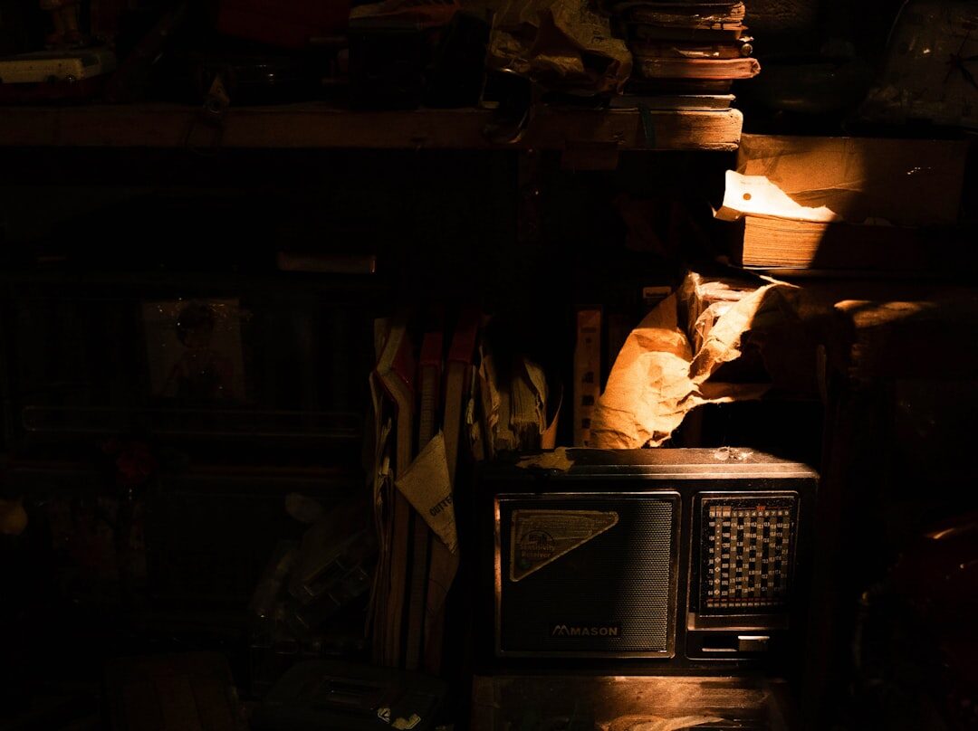 Old vintage television set glowing in a dark room